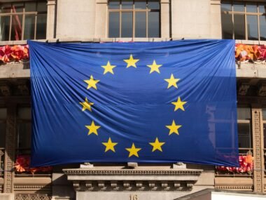 european union flag building — financial news