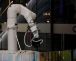 robot arm factory floor — financial news