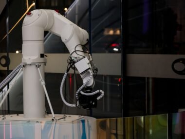 robot arm factory floor — financial news