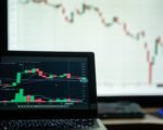 stock exchange trading floor screens — financial news
