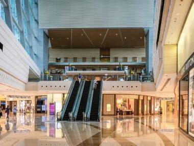 busy shopping mall interior — financial news