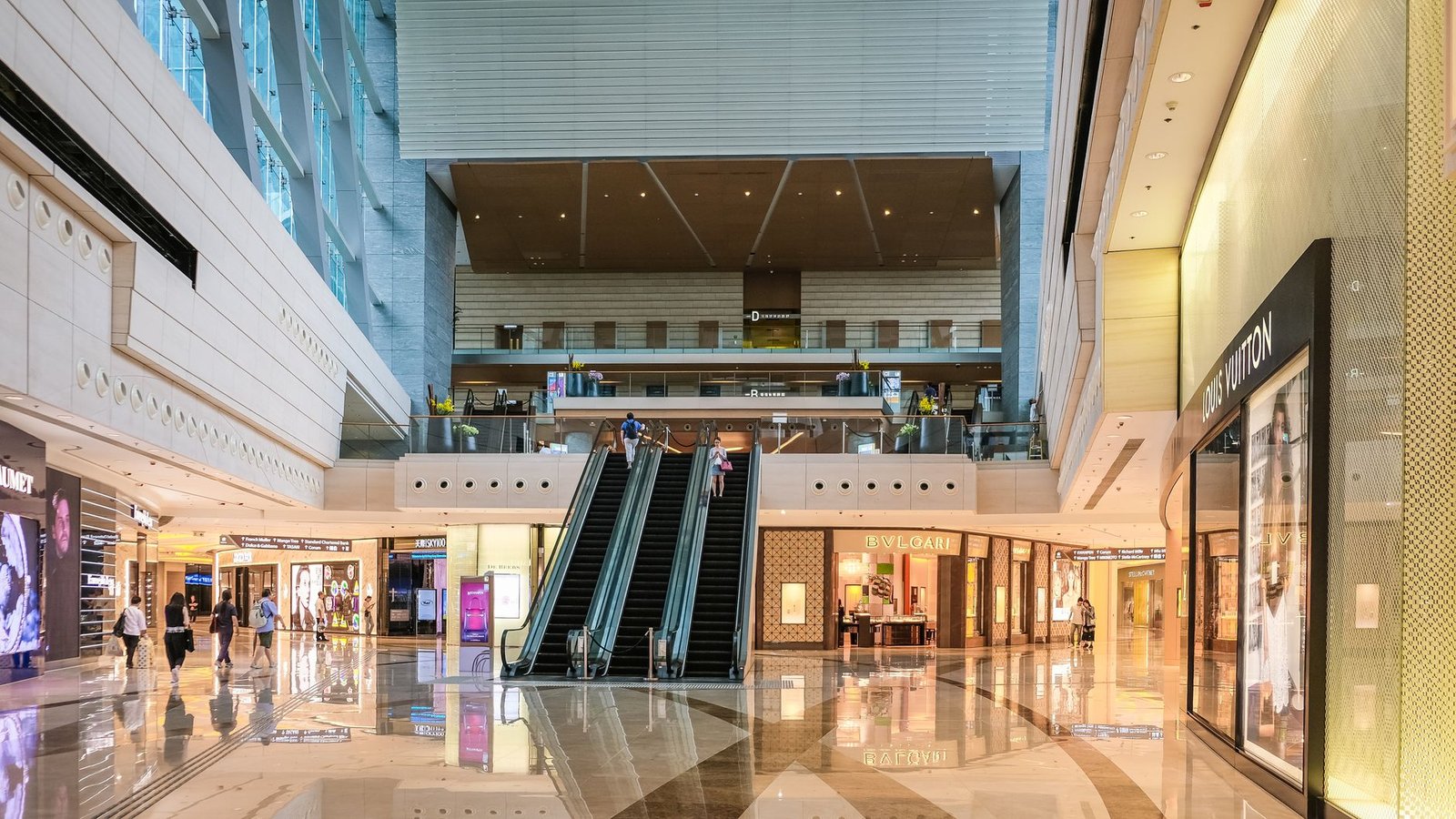 busy shopping mall interior — financial news