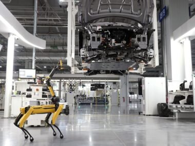 car assembly line factory — financial news