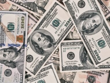 oil pump dollar bills — financial news