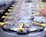 electric vehicle factory assembly line — financial news