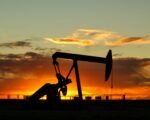 oil pump jack sunset — financial news