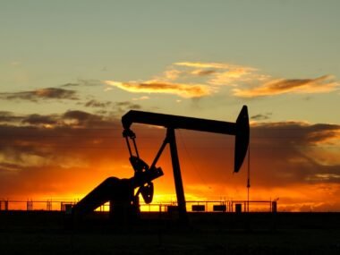 oil pump jack sunset — financial news