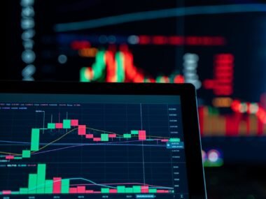 trading floor screens — financial news
